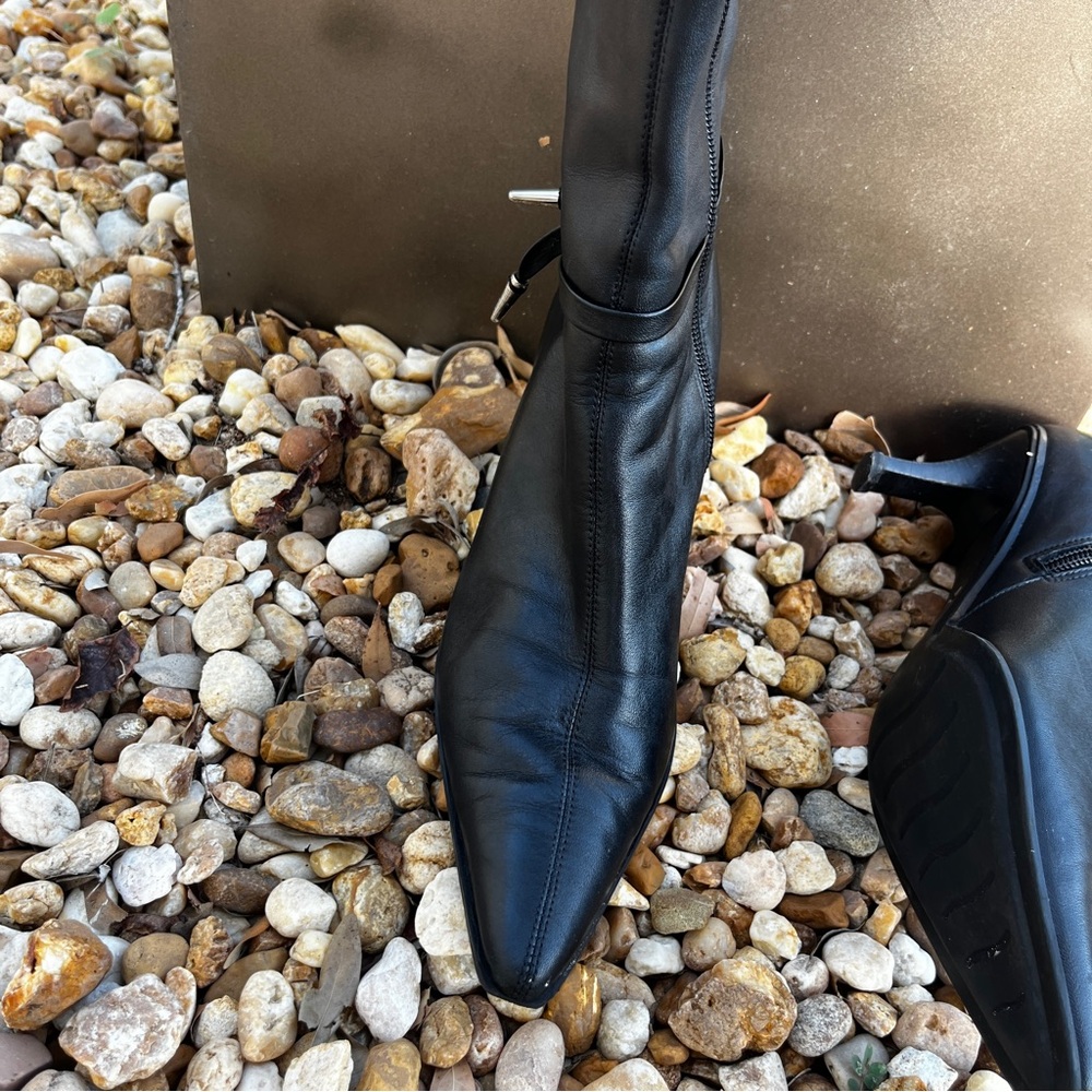 Gianni Bini Black leather ankle boot with metal tip tassel.